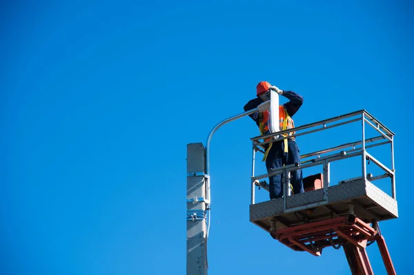 Worker Helmet Safety Protective Equipment Installs New Diode Lights Worker — Stock Photo, Image