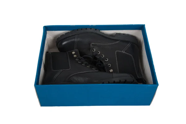 Black boots in a box — Stock Photo, Image