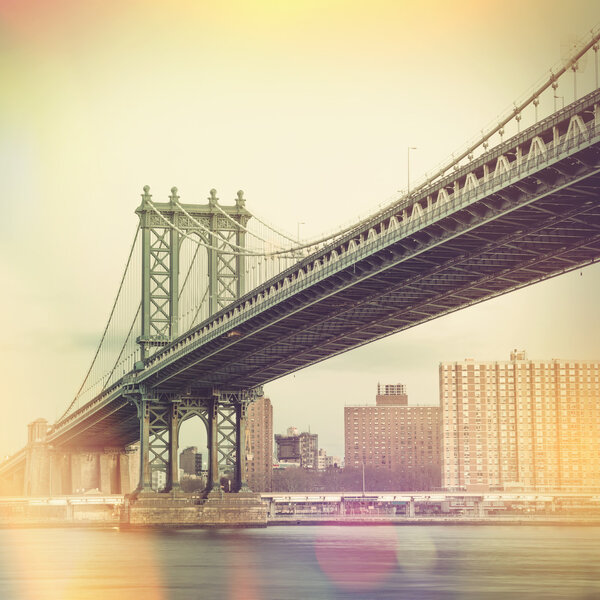 Cityscape of the Manhattan Bridge and New York City in the background, NYC, USA. Retro vintage style design