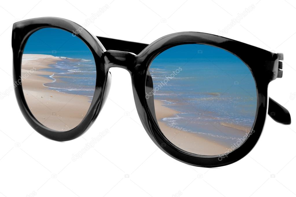 Summertime concept -  Sunglasses have a beach  reflecting on  is