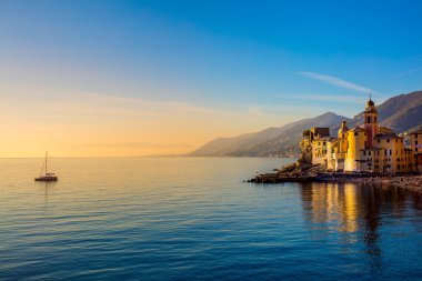 Mediterranean Sea at sunrise, small town and yacht clipart