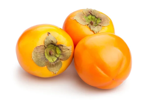 Drei ganze Persimmons — Stockfoto