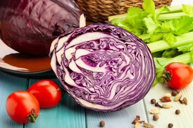 sliced red cabbage on wood background