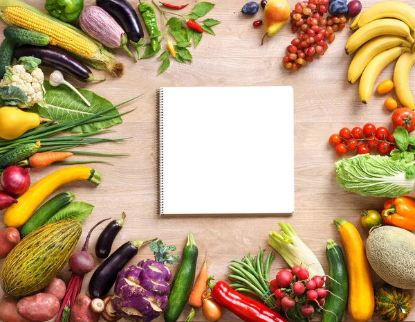 Fresh organic vegetables on a wooden background