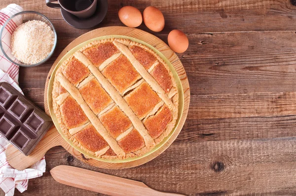 Chocolate coconut tart on wooden breadboard. — Stock Photo, Image