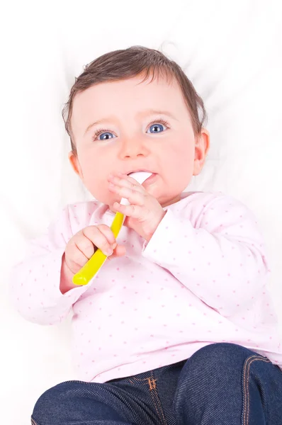 Baby girl with spoon. — Stock Photo, Image