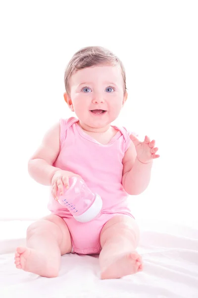 Mädchen mit rosa Babyflasche. — Stockfoto