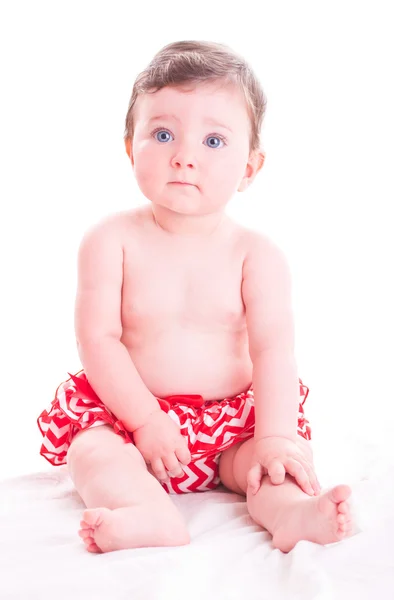 Μωρό κορίτσι με κόκκινο παντελόνι. — Φωτογραφία Αρχείου