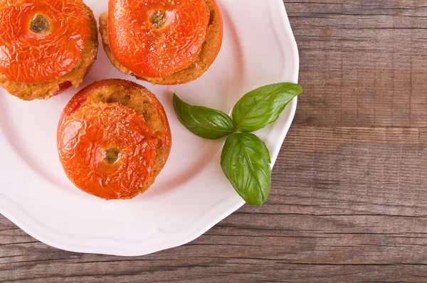 Stuffed tomatoes on a white plate. — Stock Photo, Image