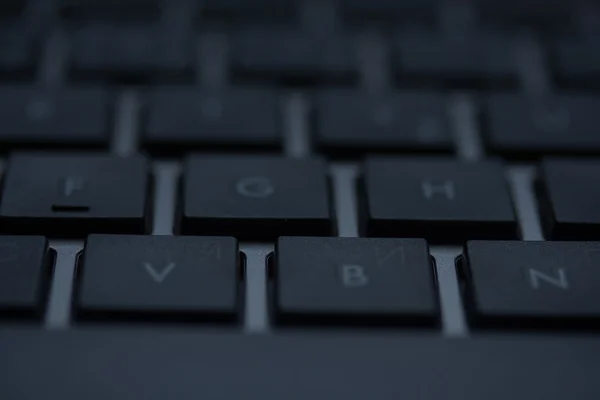 De moderne laptop toetsenbord macro-opnamen — Stockfoto
