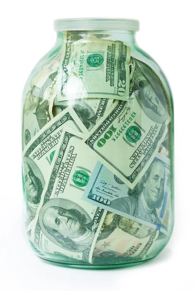 Dólares en el frasco de vidrio aislado sobre fondo blanco — Foto de Stock