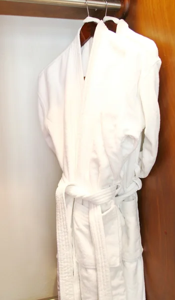 Luxury white bathrobes hanging — Stock Photo, Image