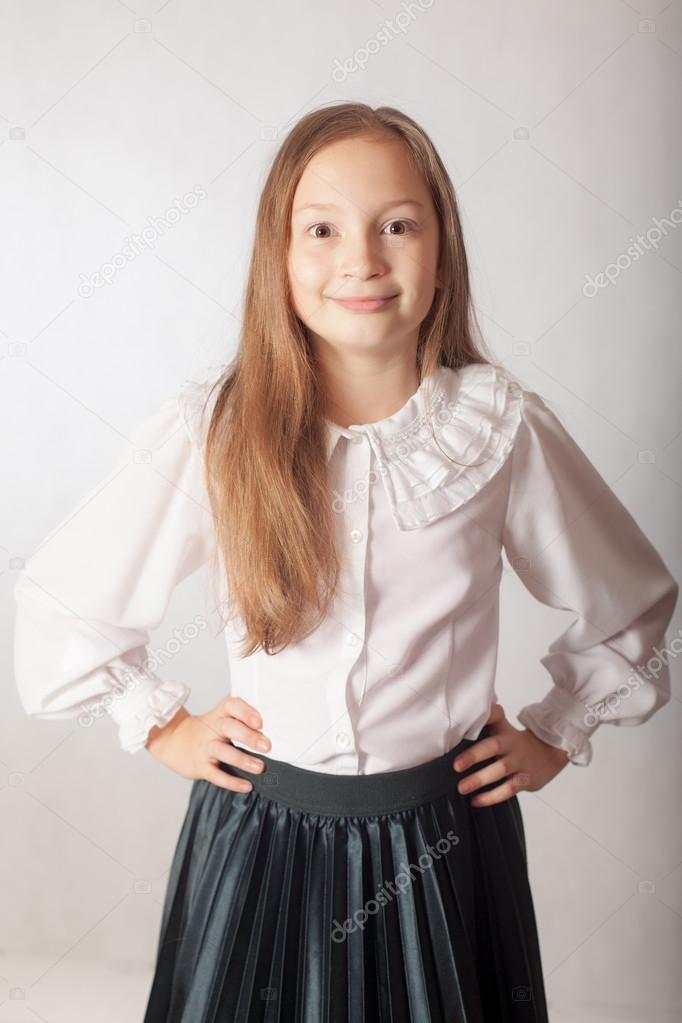 funny schoolgirl in a white blouse