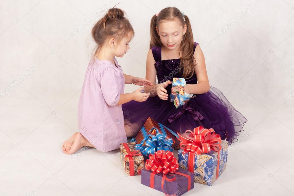 two sisters open gifts