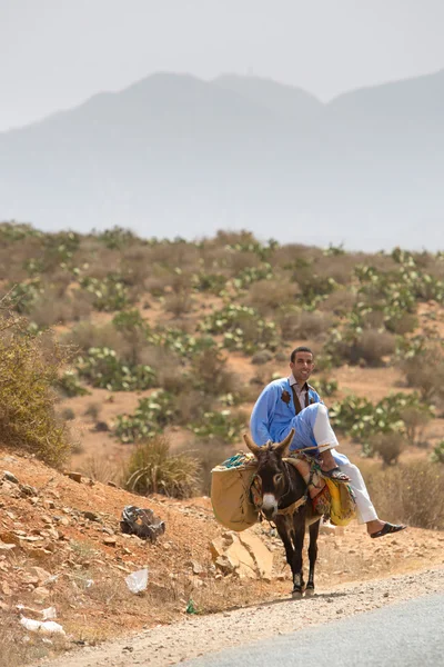 Moroccan man sitting on his donkey, Morocco — Stock Photo, Image