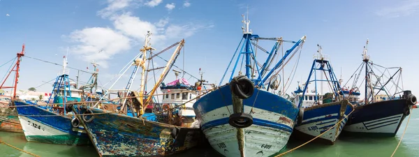 vintage wooden fishing boats in the harbor of Essaouira