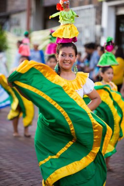 Woman dancing during Carnival, Galapagos Islands clipart