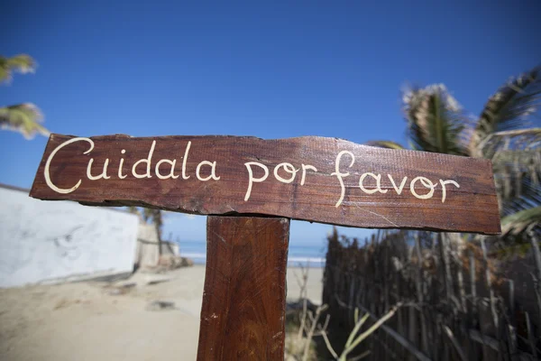 Wooden sign post at the beach of Mancora — Stock Fotó