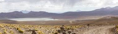 Mountains and salt pan in Eduardo Avaroa Reserve, Bolivia