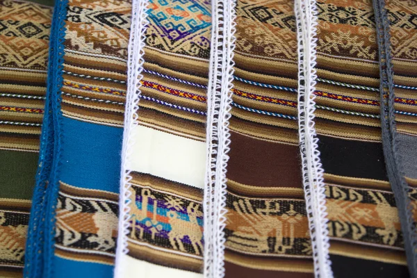 Background of colored fabrics from Bolivia ethnic market — Stock Photo, Image