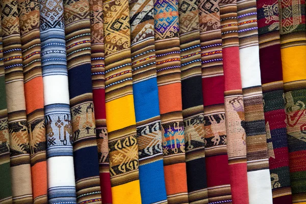 Background of colored fabrics from Bolivia ethnic market — Stock Photo, Image