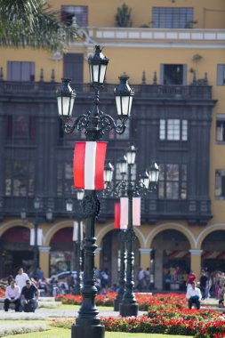 Old belvedere and flag from Peru on Plaza de Armas, Lima