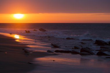Ocean sunset on the Pacific Ocean in Punta Sal, Peru