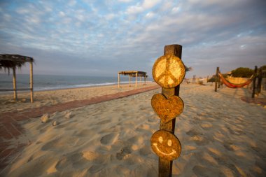 Sunset on the beach of Punta Sal with empty campsite, Peru