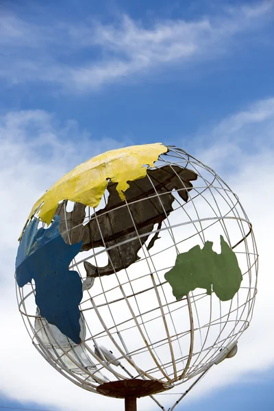 Iron earth globe structure with blue sky and Asia continent — Stock Photo, Image