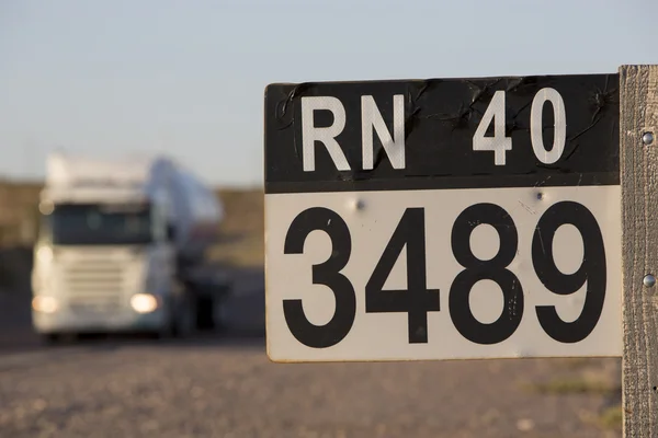 Route 40 sign road and truck in north of Argentina — Stock Photo, Image