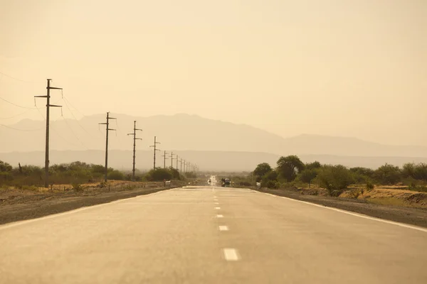 Sunset on mountains and straight road 40 in Argentina — Stok fotoğraf