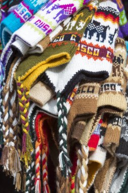 Group of colored Peruvian snow cap for sale at the Cusco market.