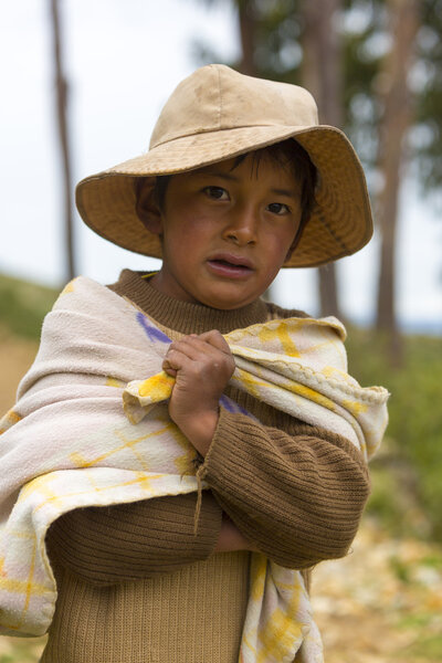 Bolivian kid standing on Isla del Sol near Copacabana, Bolivia