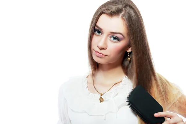 Mujer peinándose el pelo —  Fotos de Stock