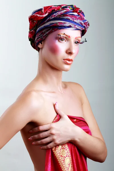 Turban and with artistic visage — Stock Photo, Image