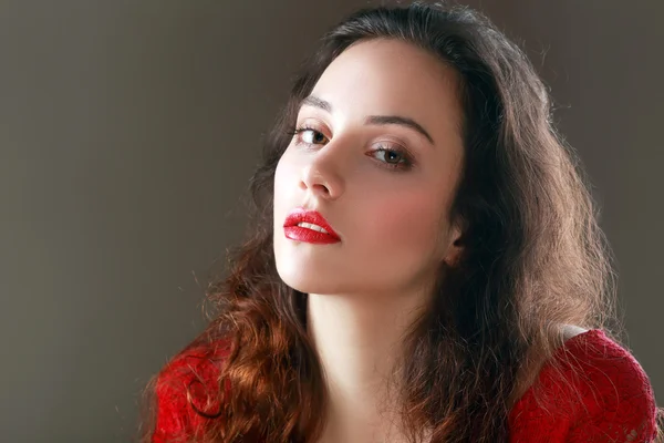 Beautiful brunette with red lips — Stock Photo, Image