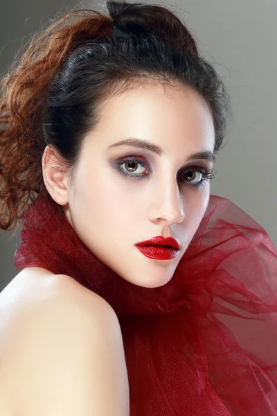 Beautiful woman in red scarf — Stock Photo, Image