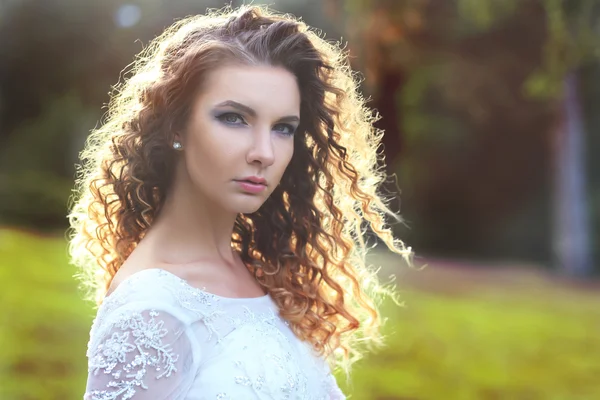 Beautiful bride with curly hair — Stock Photo, Image