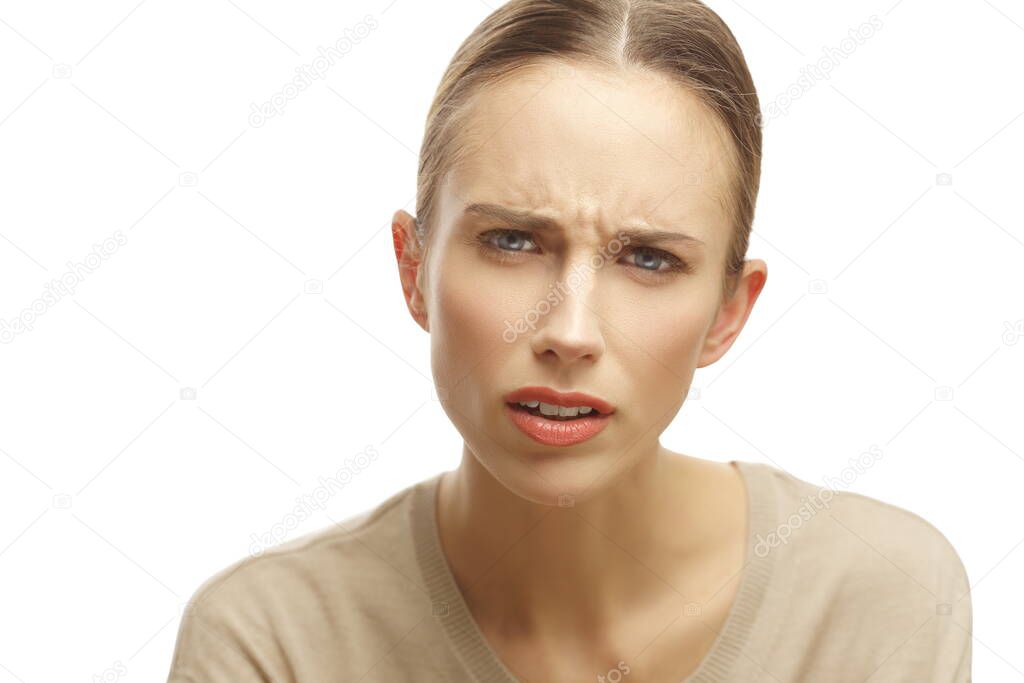 Portrait of annoyed woman looking questioningly isolated over white background