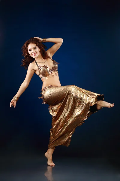 Belly dancer in gold — Stock Photo, Image