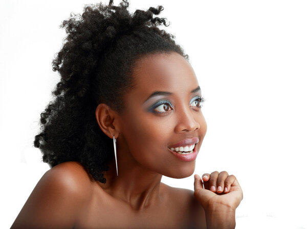 Beautiful african young woman looking outside the picture. Isolated over white background