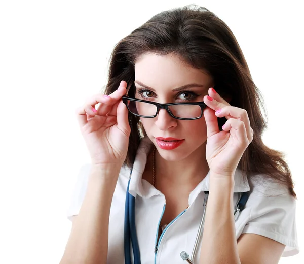 Doctor looking over the glasses. — Stock Photo, Image