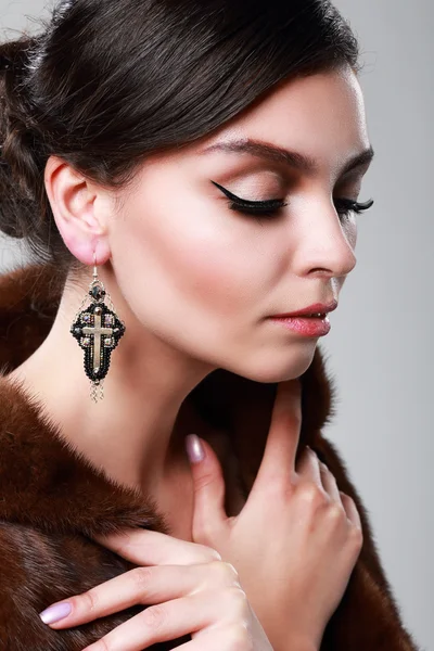 Woman wearing earrings — Stock Photo, Image