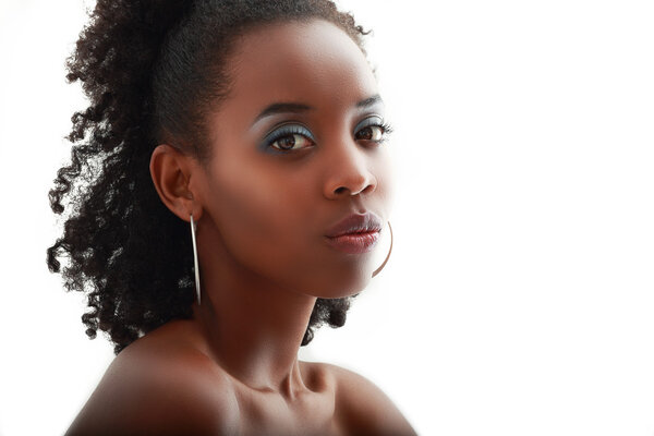 Beautiful black woman face with perfect make up over white