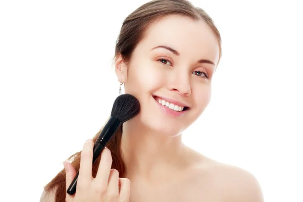 Vrouw en make-up toe te passen — Stockfoto