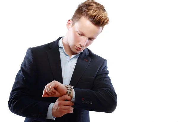 Young businessman looking at watch — Stock Photo, Image
