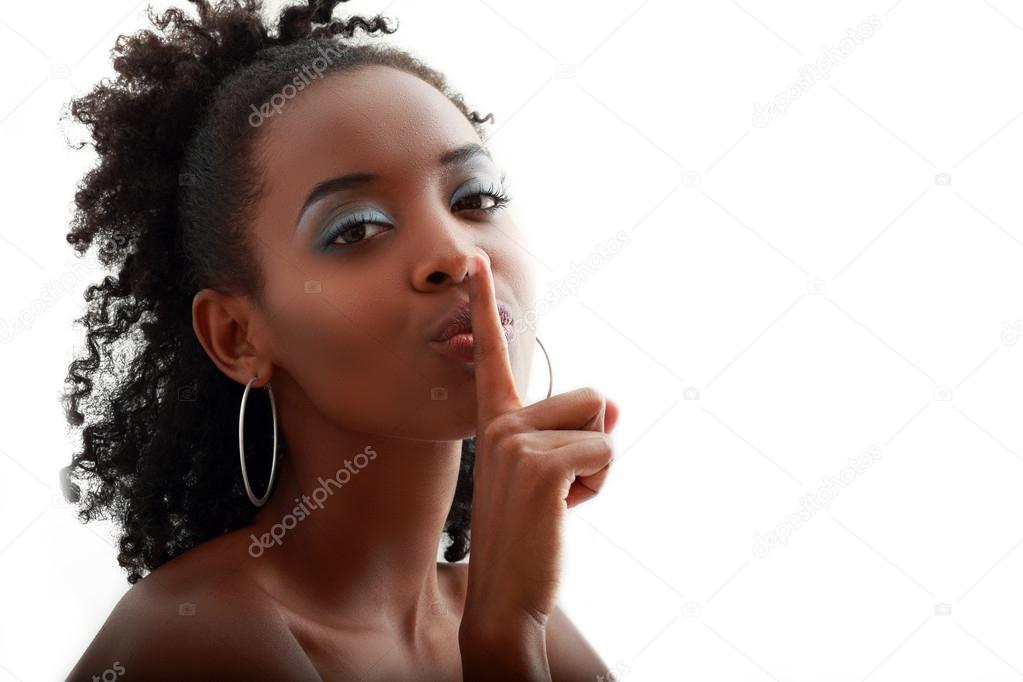 African American woman making  hushing gesture