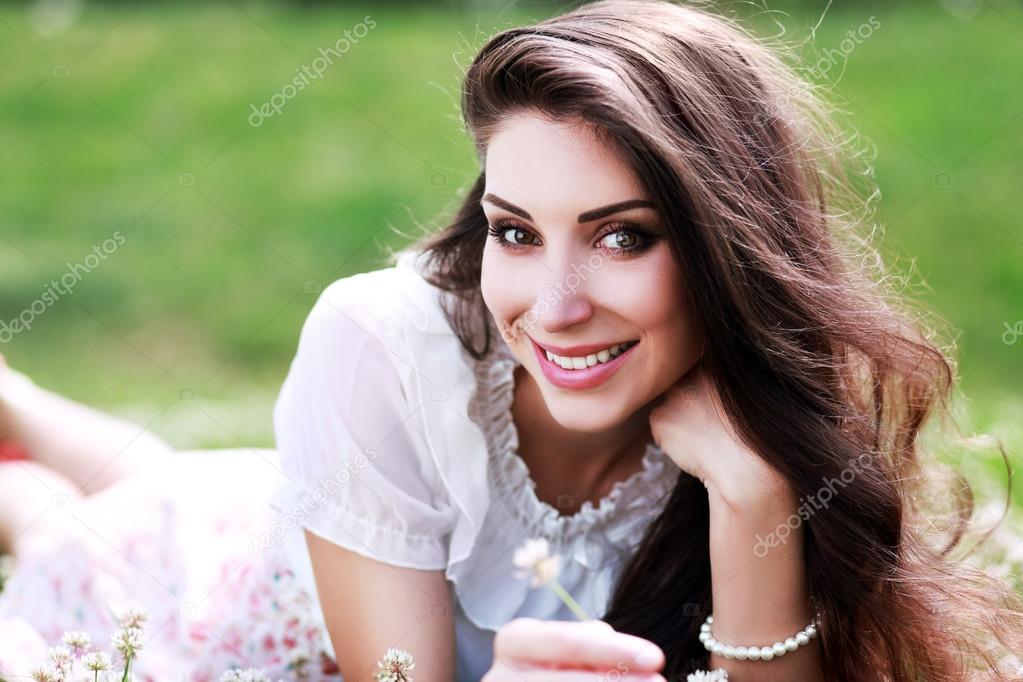 Beautiful brunette woman with flowers