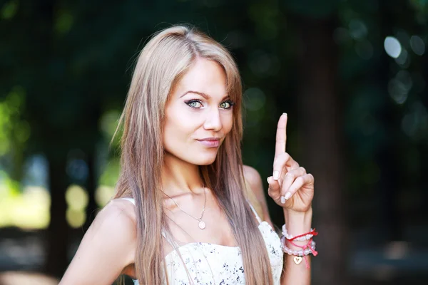 Woman showing finger — Stock Photo, Image