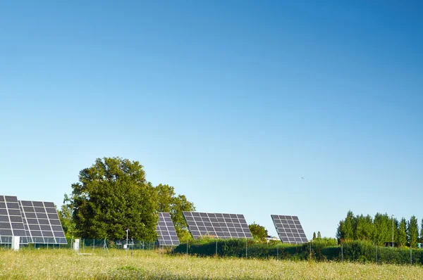 Line large solar panels on the nature — Stock Photo, Image